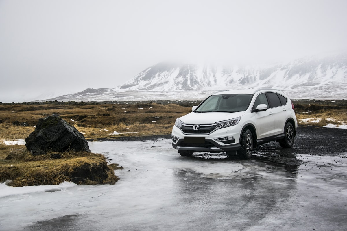 Silver midsize SUV loaded with luggage for a European road trip